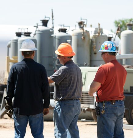 Maintenance crew in hard hats at an industrial plant, reflecting a culture of discipline in daily operations