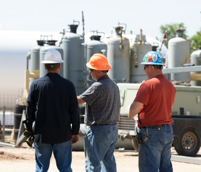 Maintenance crew in hard hats at an industrial plant, reflecting a culture of discipline in daily operations